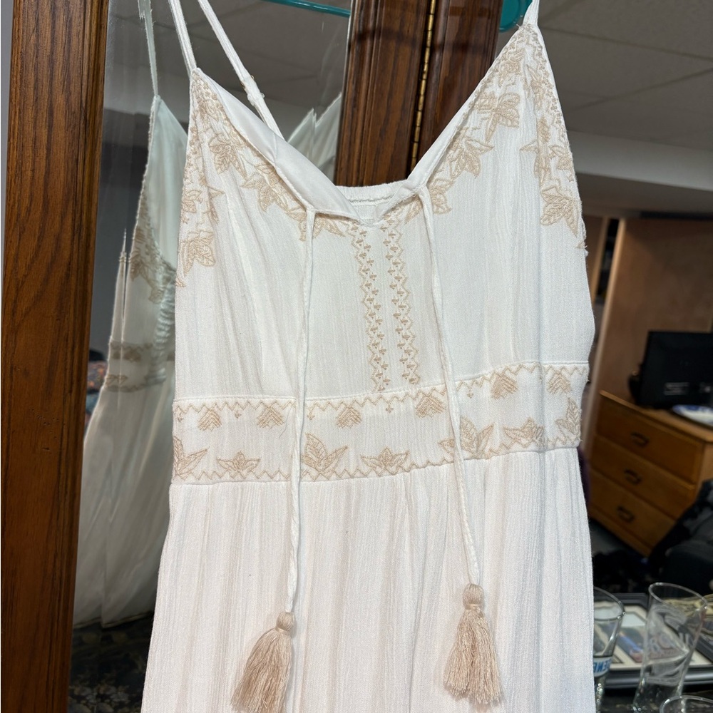 Maxi dress cream color with pretty embroidery lined. Size large